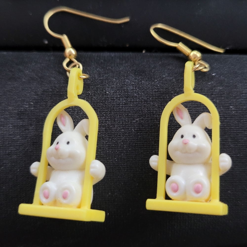 Vintage Russ Rabbit earring on a yellow swing